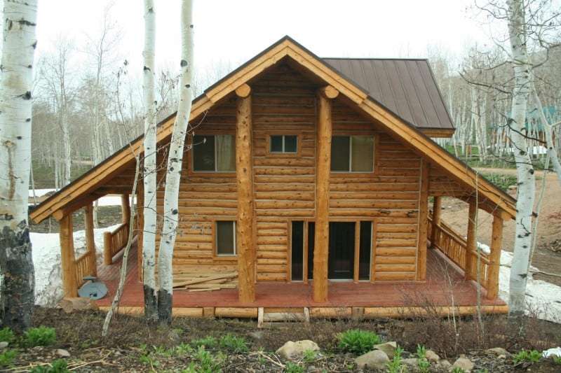 Hand peeled or Hand hewn custom Log Siding. Pioneer finish on the logs.