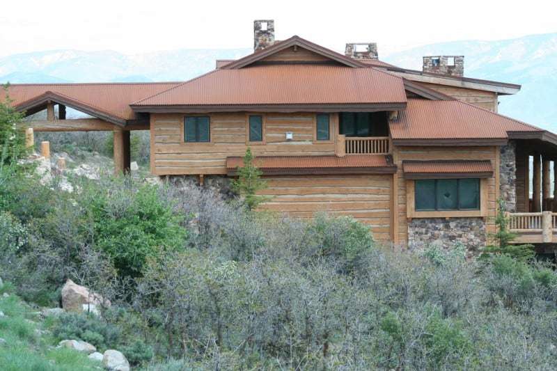 Natural Edge Wood Siding. Rustic Wood Siding with Chinking between pieces.