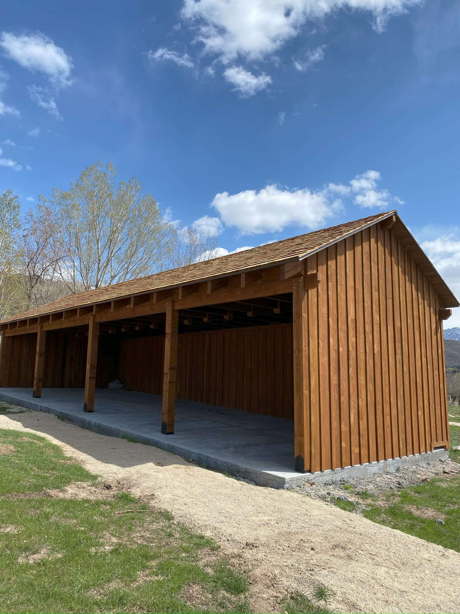 Horse Stalls build out of rough sawn timbers with Board and Batten Siding. Stained with Sashco Transformation Log & Timber Stain.